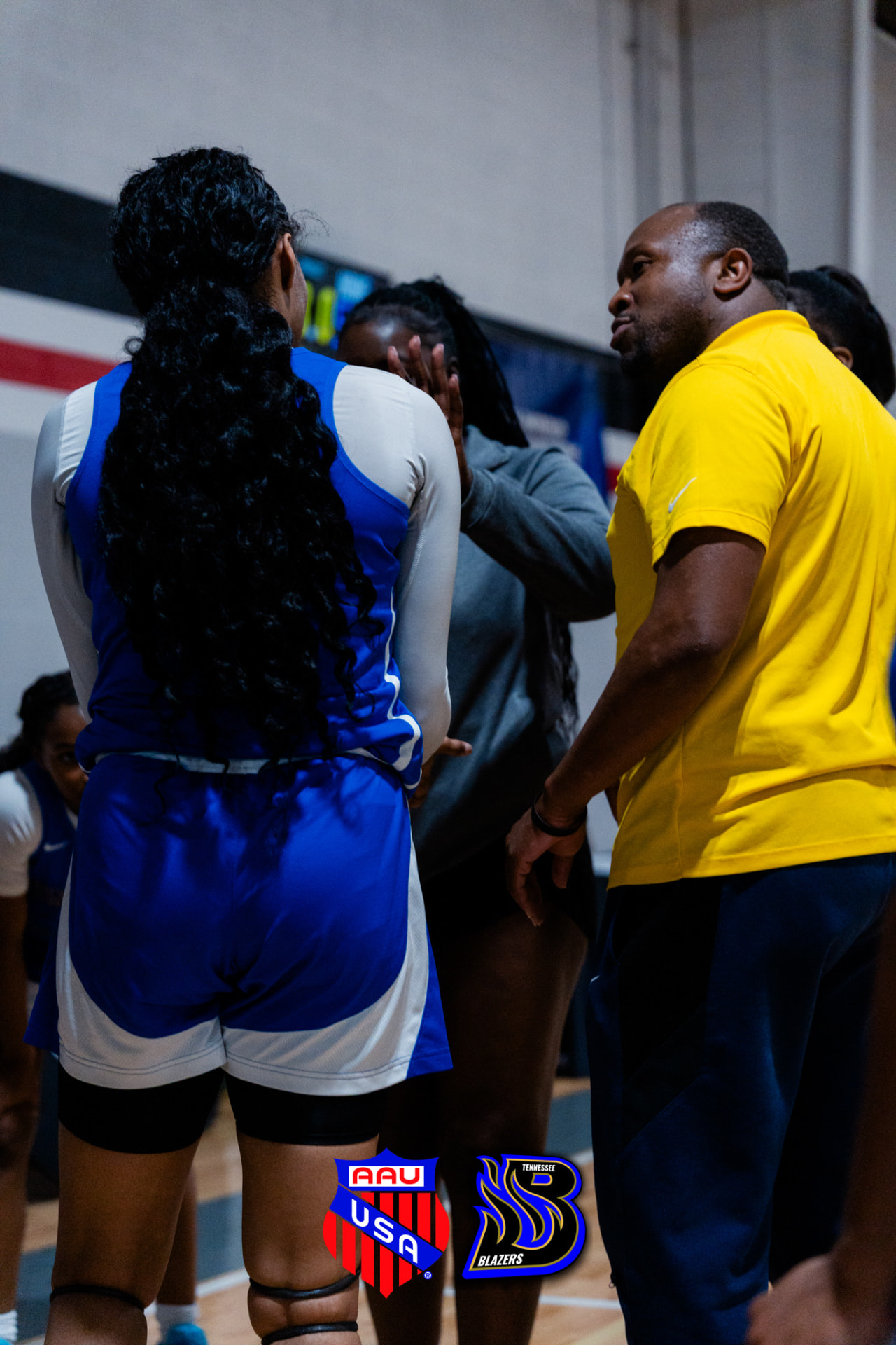 Coach speaking with TN Blazers players in a huddle