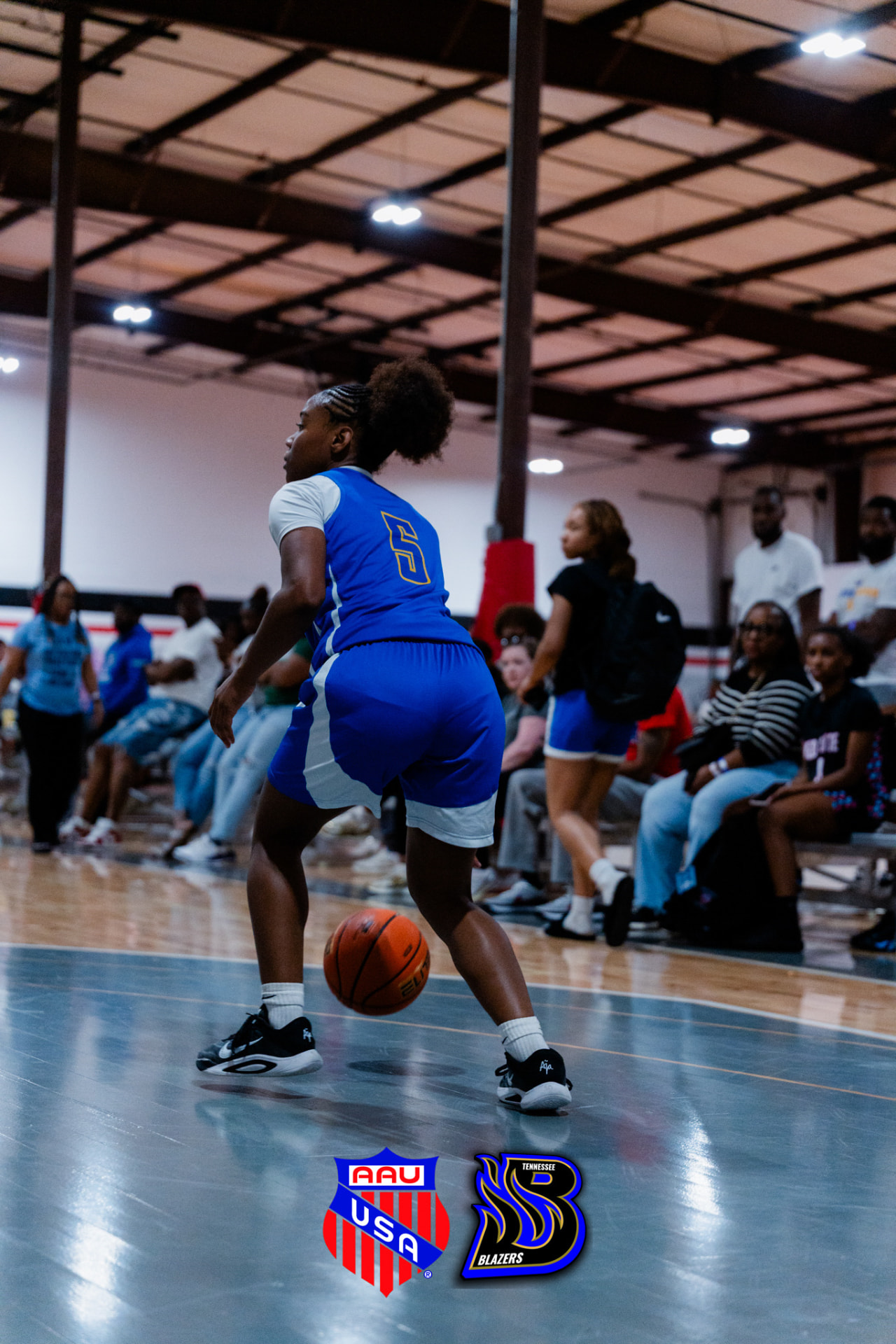 TN Blazers guard handling the ball in the open floor