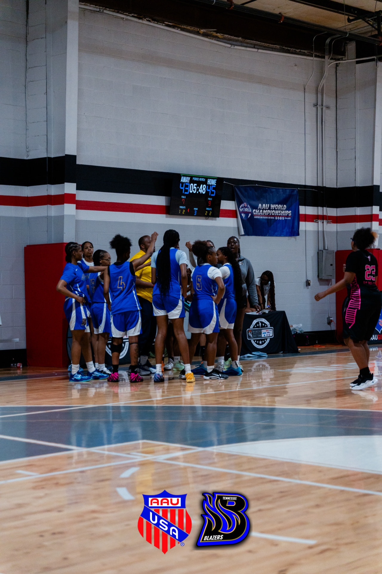 TN Blazers Elite team huddle during an AAU World Championships game
