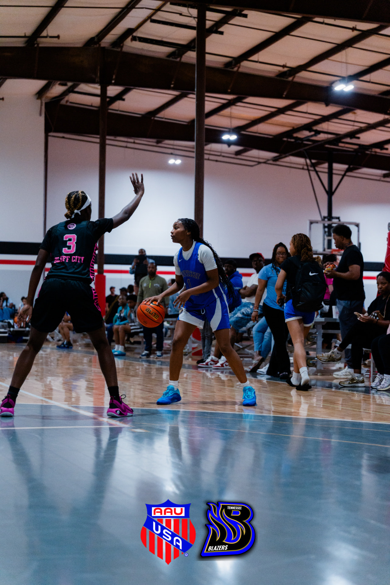 TN Blazers player sizing up a defender at the top of the key